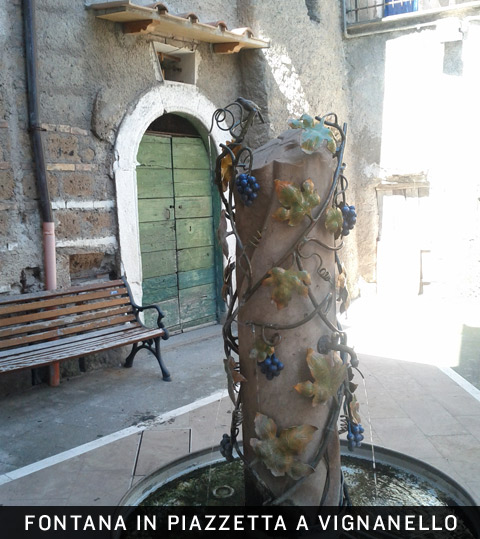 Fontana in piazzetta a Vignanello (Viterbo), scorcio di paesino.